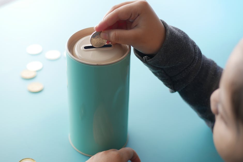 Child placing coins into a savings jar — teaching kids about money