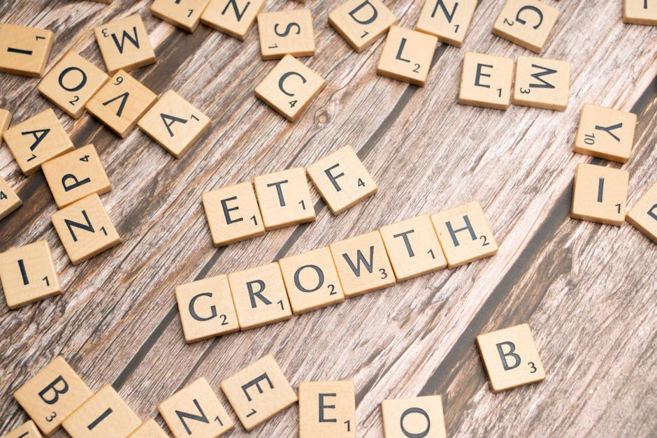 Investment portfolio growth concept with ETF wooden blocks