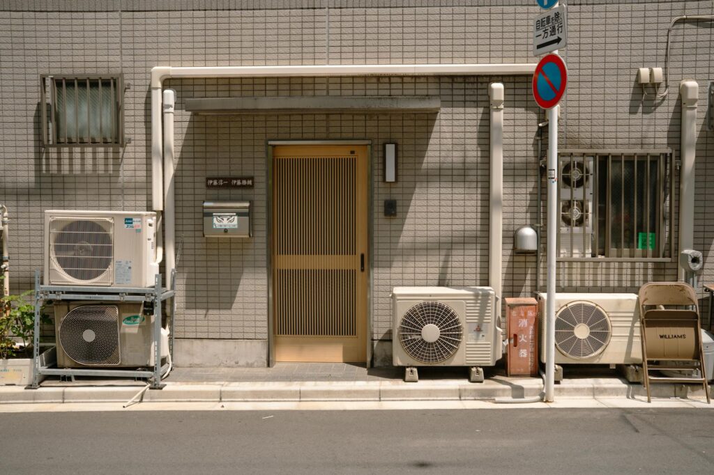 Air source heat pump installed beside a UK home