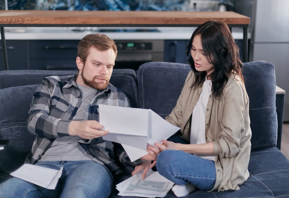 Married couple filling in tax paperwork at home — UK Marriage Allowance claim