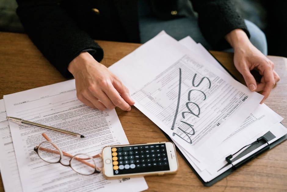 UK self-assessment taxpayer reviewing payment on account documents at a desk