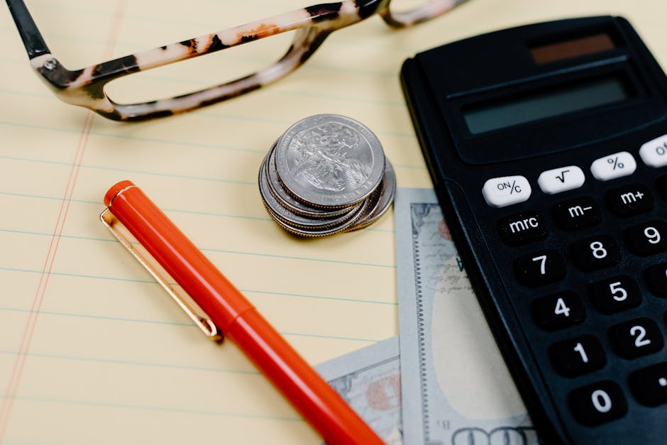 Calculator and coins representing savings interest