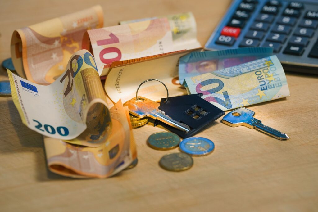 UK homeowner using a calculator and coins to work out mortgage overpayments in 2026
